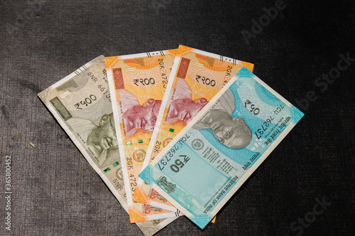 New Indian currency 500, 200 and 50 isolated on black wooden background