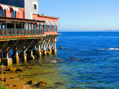 Εκτύπωση καμβά Restaurants and a rocky beach at Cannery Row, in Monterey bay, California