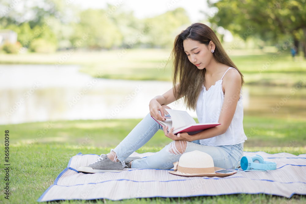 Beauty Asian woman read book in park Beauty Asian woman read book in park