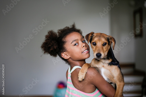 Little girl with her puppy