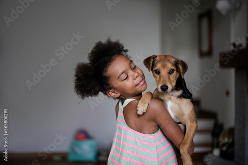 Little girl with her puppy