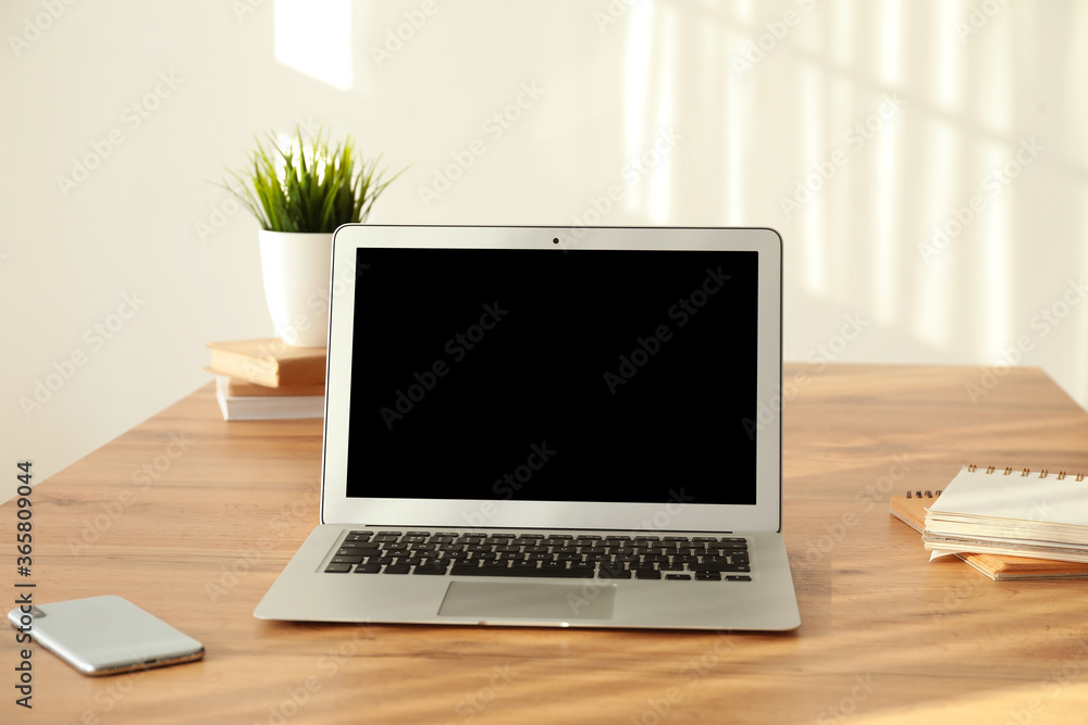 Modern laptop with mobile phone at workplace Modern laptop with mobile phone at workplace