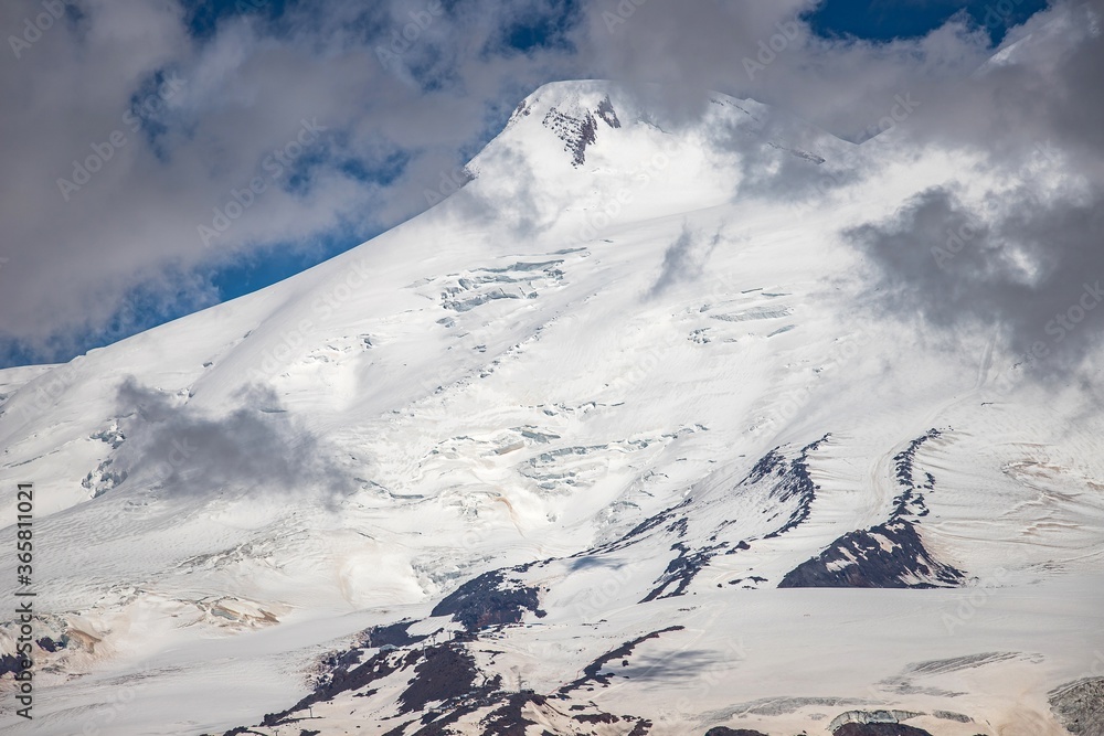 Amazing snowy Elbrus mount from Cheget mountain. It's a dormant volcano in the Caucasus Mountains in Southern Russia, Kabardino-Balkaria region.