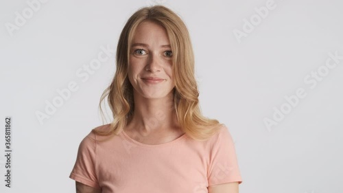 Wallpaper Mural Beautiful blond girl happily agreeing on camera over gray background. Yes expression Torontodigital.ca