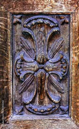 Elegant traditional wooden decoration at entrance door.