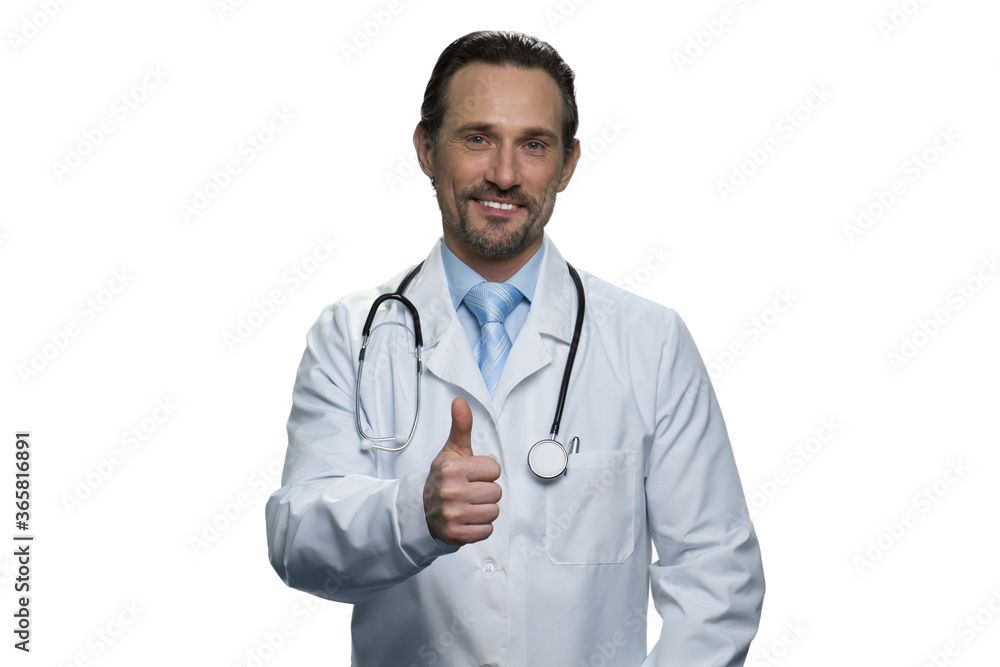 Portrait of american mature doctor giving a thumb up. Caucasian middle-aged doctor with stethoscope isolated on white background.