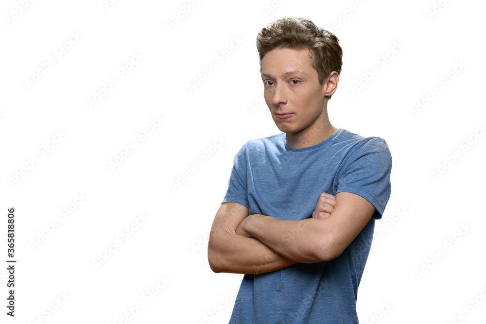 Teen caucasian skinny guy with folded arms. Isolated on white background. Teen caucasian skinny guy with folded arms. Isolated on white background.
