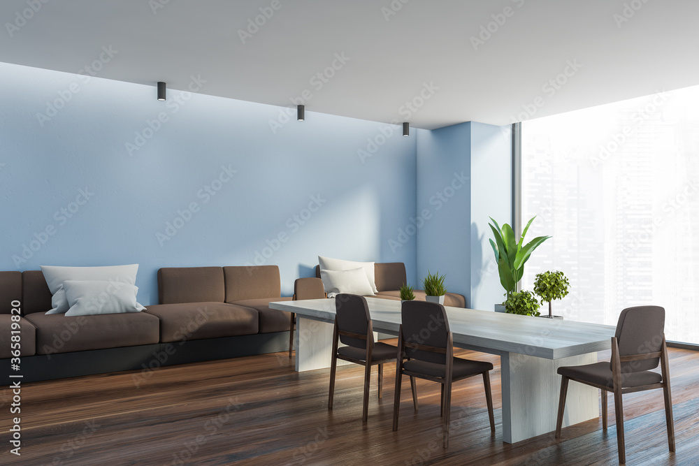 Panoramic blue dining room corner with sofa