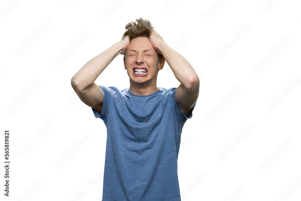 Stress and failure concept. Nervous breakdown of a teenage boy against white background. Stress and failure concept. Nervous breakdown of a teenage boy against white background.