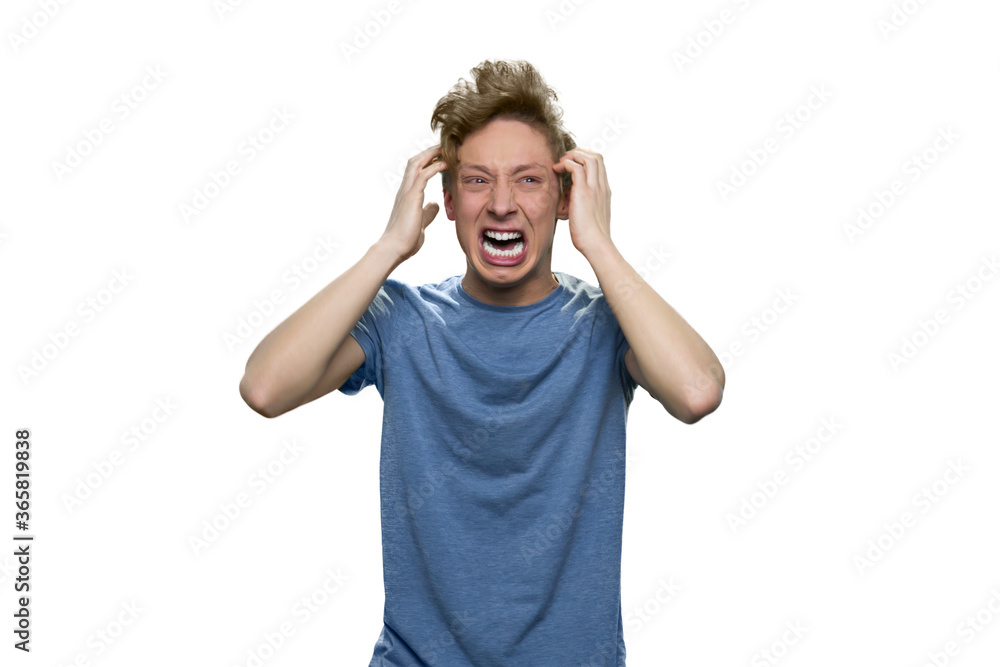 Nervous breakdown of teenage boy. Angry stressed guy is yelling and screaming isolated on white background. Nervous breakdown of teenage boy. Angry stressed guy is yelling and screaming isolated on white background.