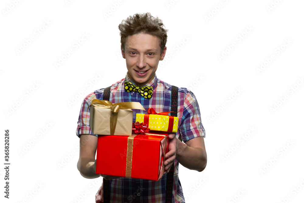 Portrait of happy cheerful boy holding presents. Young teenager is giving gift boxes. Isolated on white background. Portrait of happy cheerful boy holding presents. Young teenager is giving gift boxes. Isolated on white background.