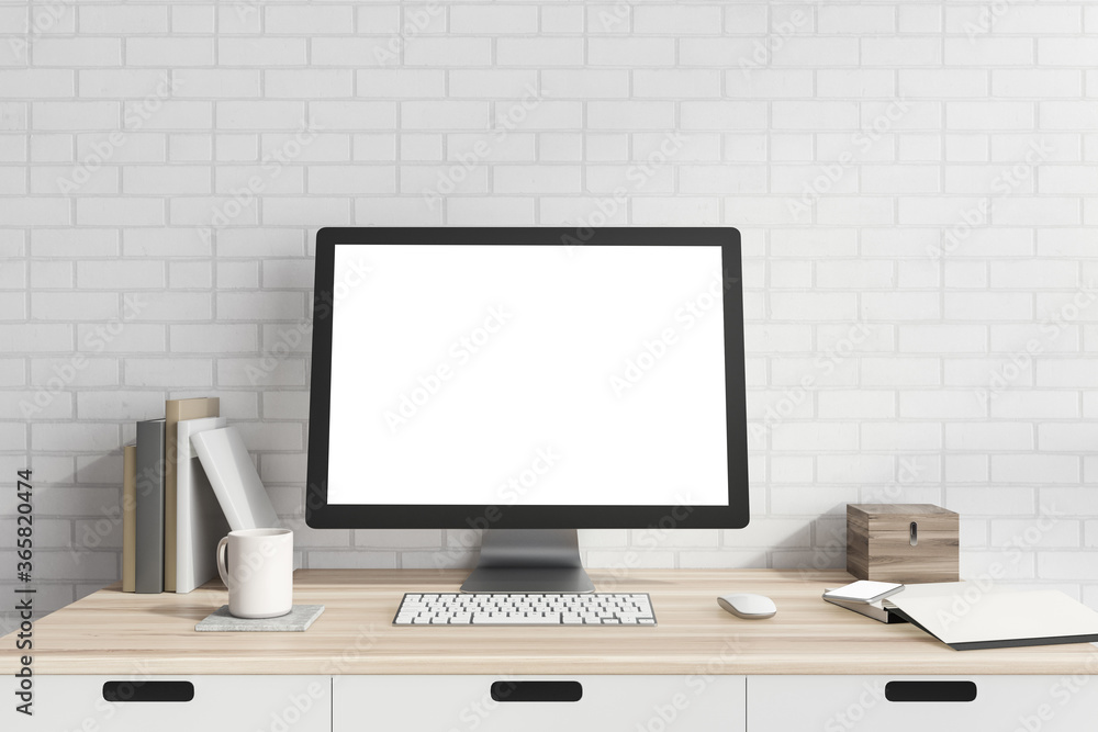 Mock up computer screen in white brick room Mock up computer screen in white brick room