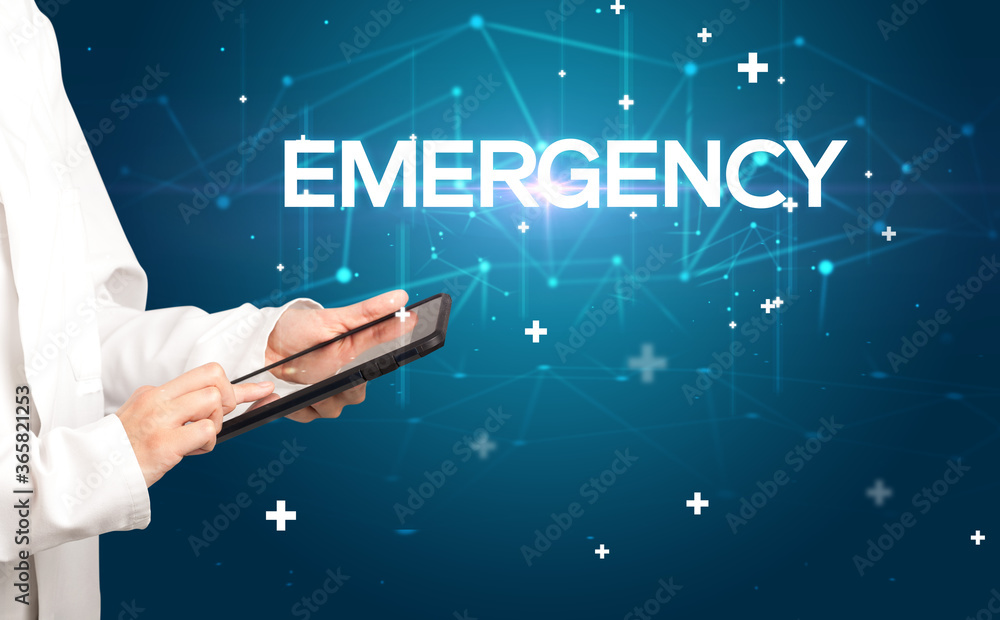 Doctor fills out medical record with EMERGENCY inscription, medical concept Doctor fills out medical record with EMERGENCY inscription, medical concept