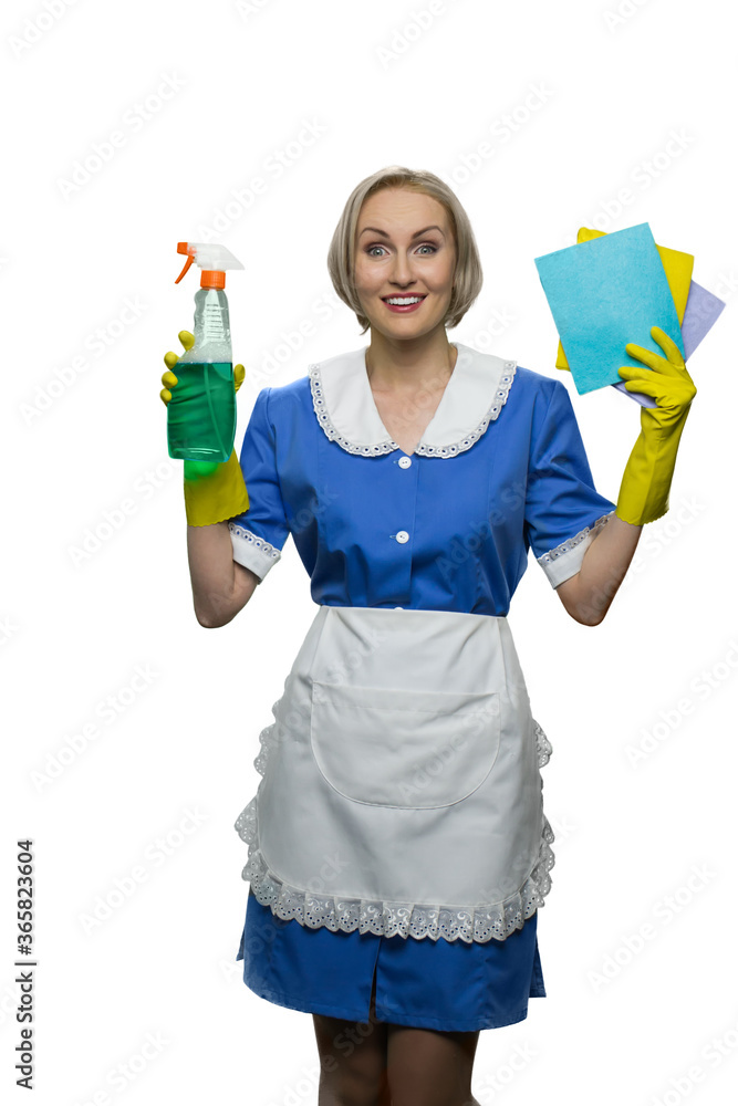 Happy smiling maid is holding cleaner spray and sponge cloths. Cleaning house concept. Isolated on white background. Happy smiling maid is holding cleaner spray and sponge cloths. Cleaning house concept. Isolated on white background.