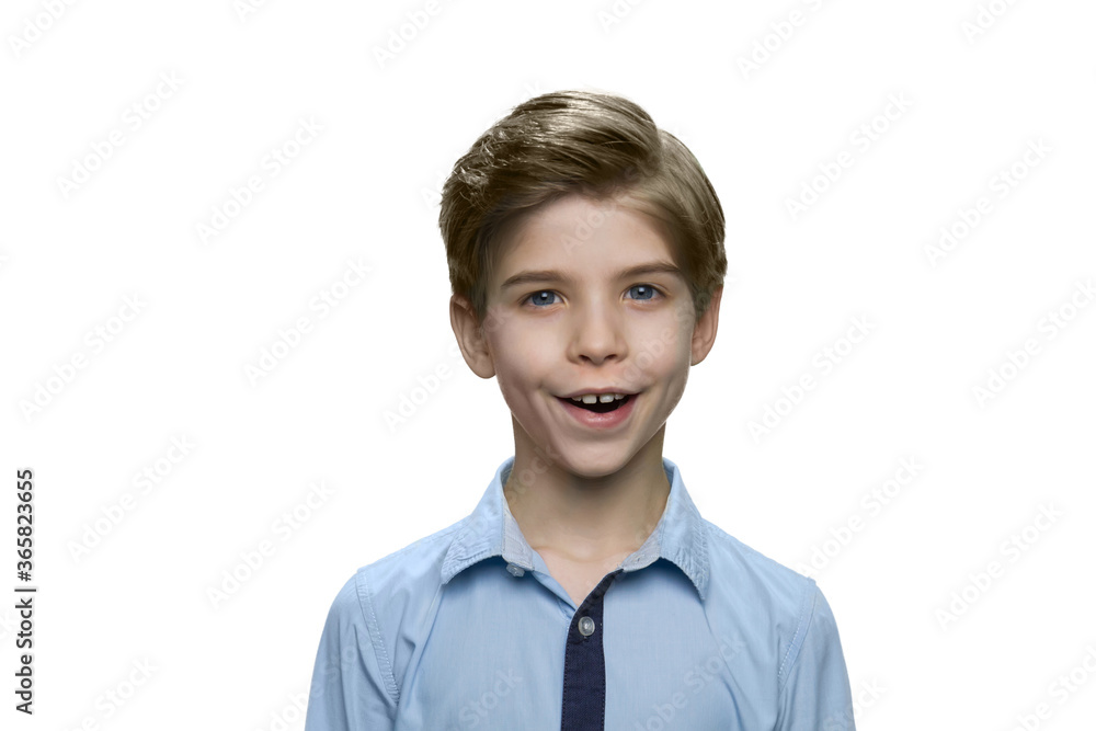 Portrait of happy child. Joyfully surprised boy in blue shirt on white background. Portrait of happy child. Joyfully surprised boy in blue shirt on white background.