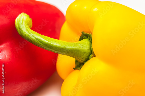 Large, red and yellow ripe peppers isolated on white background  photo