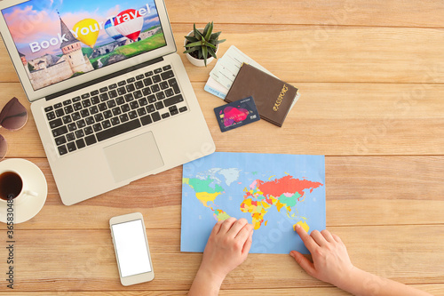 Woman with laptop booking t...