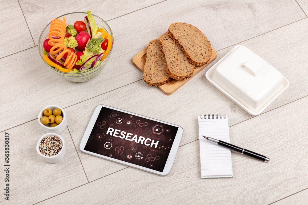 Healthy Tablet Pc compostion with RESEARCH inscription, immune system boost concept Healthy Tablet Pc compostion with RESEARCH inscription, immune system boost concept