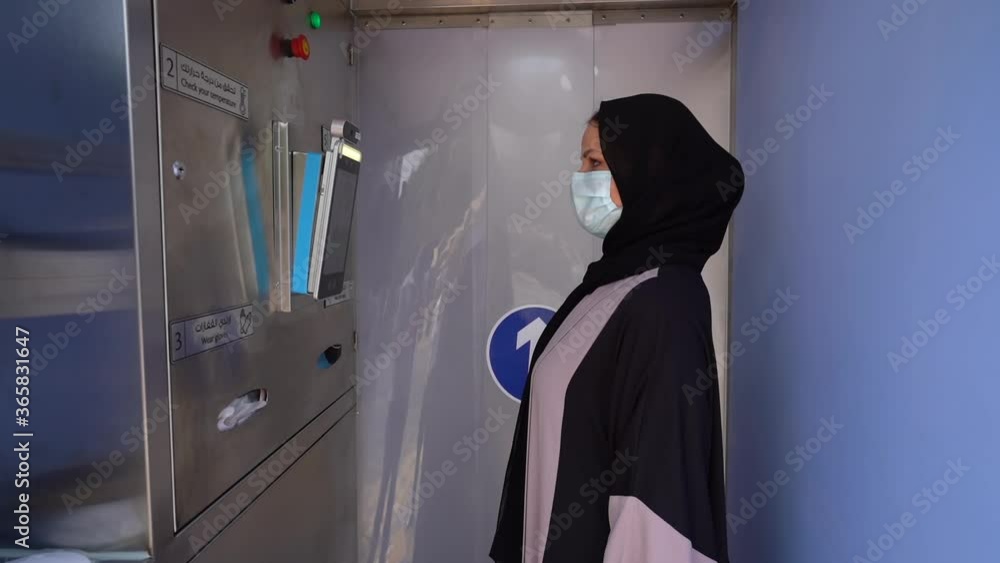 girl in an abaya in Sterilization Gates. check temperature girl in an abaya in Sterilization Gates. check temperature
