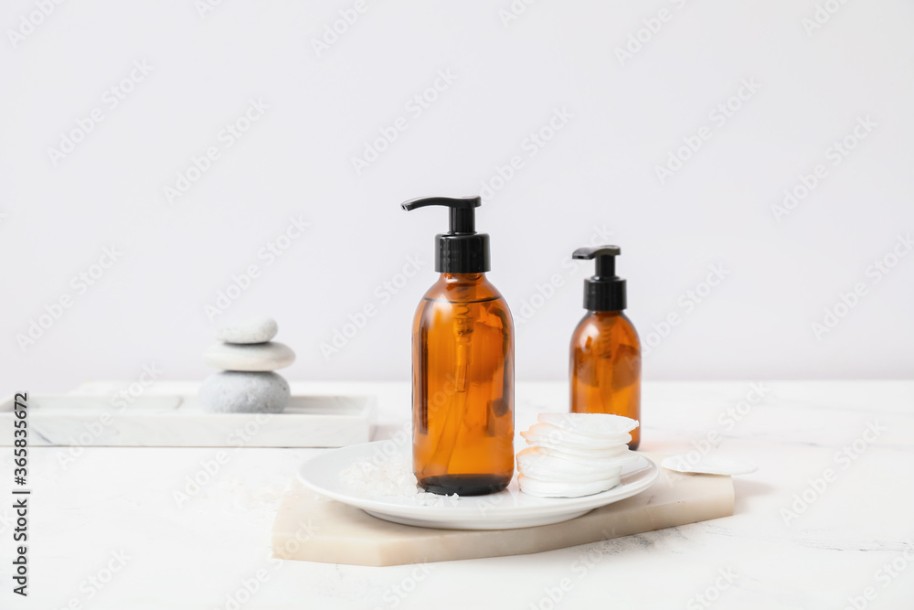 Bottles of different cosmetics on table Bottles of different cosmetics on table