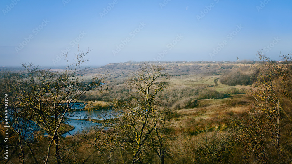 View from the mountain to the blue lake. View from the mountain to the blue lake.