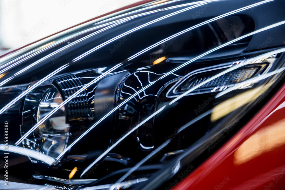 Headlights and details of red sport car