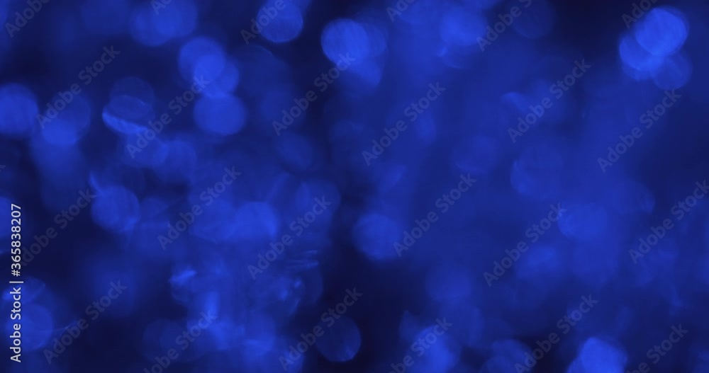 Chaotic motion of blue blurry lights reflected in the water. Chaotic motion of blue blurry lights reflected in the water.