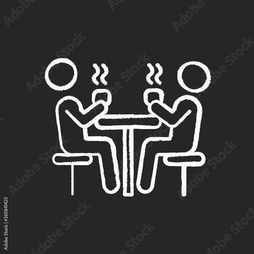 Dining hall chalk white icon on black background. School cafeteria. University canteen. Students having lunch at table. People drinking hot drinks. Isolated vector chalkboard illustration