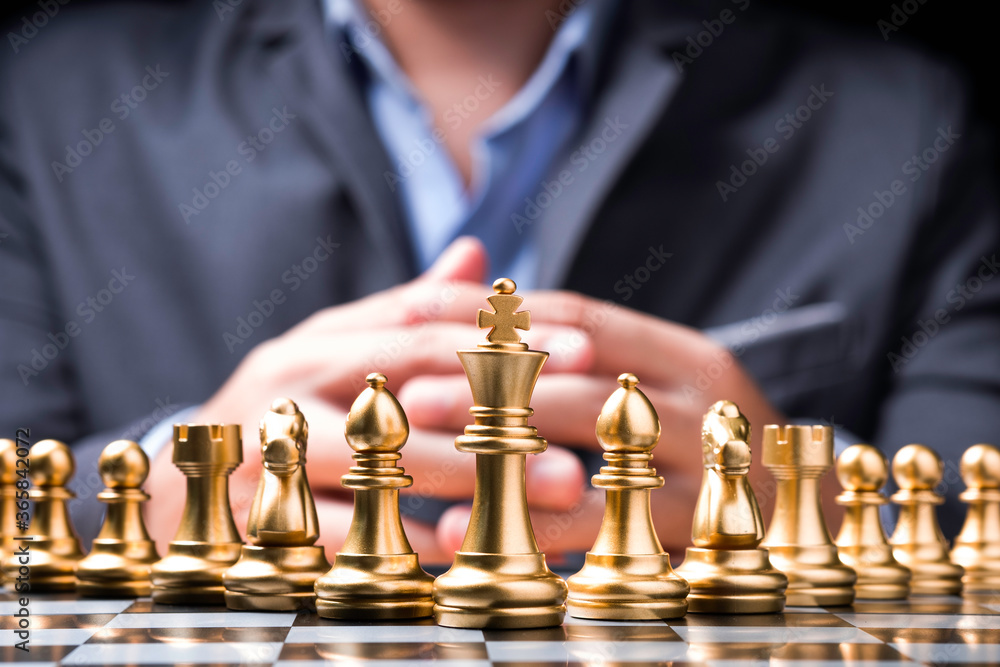 custom made wallpaper toronto digitalGolden chess pieces on chess board and in front of businessman.Business competition and marketing strategy planing concept.