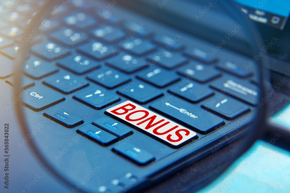 A laptop computer with a magnifying glass. A laptop computer with a magnifying glass.