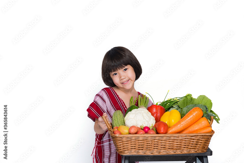 kid carrying vegetables basket on gray background
kid carrying vegetables basket on gray background