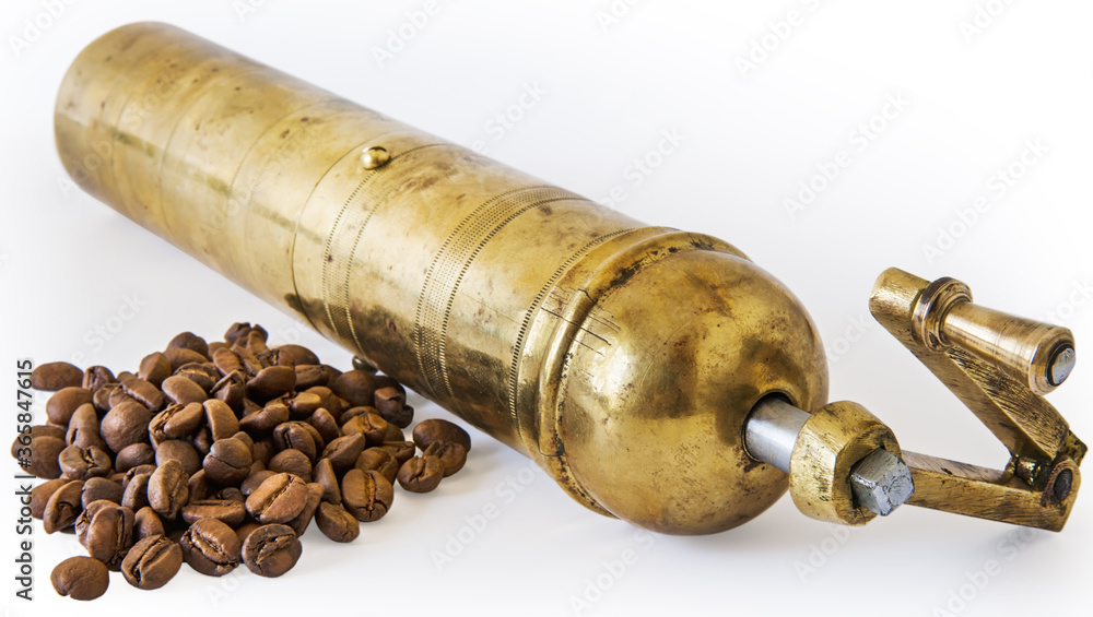 Antique coffee grinder with coffee beans