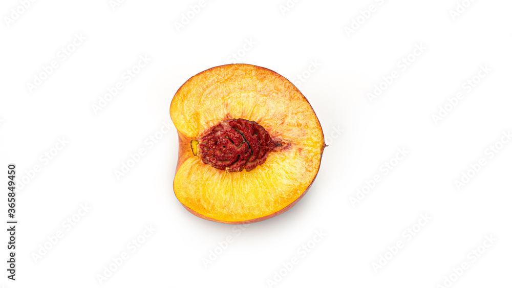 Half nectarine with stone on a white background from different sides. Macro photo. High quality photo