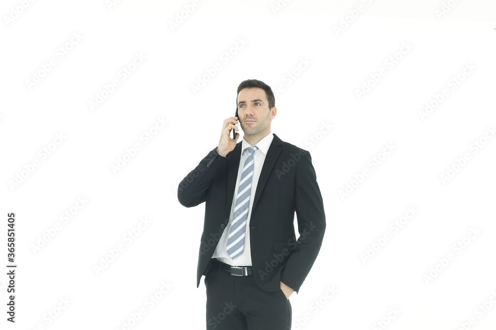 Handsome businessman in a suit hand holding smartphone and talking on the phone isolated on white background.Copy Space Handsome businessman in a suit hand holding smartphone and talking on the phone isolated on white background.Copy Space