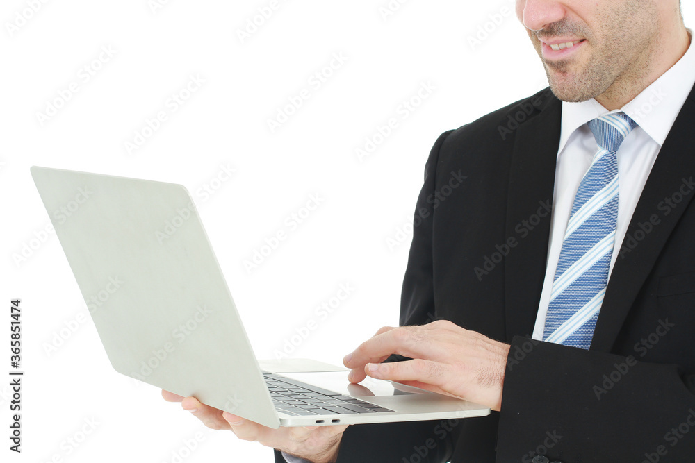 Close up handsome businessman in a suit smiling with hand holding notebook. He working on a laptop isolated on white background Close up handsome businessman in a suit smiling with hand holding notebook. He working on a laptop isolated on white background