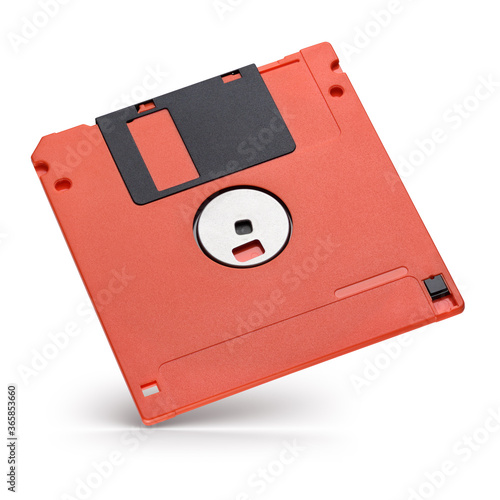 Red 3.5-inch floppy magnetic disk or diskette isolated on white