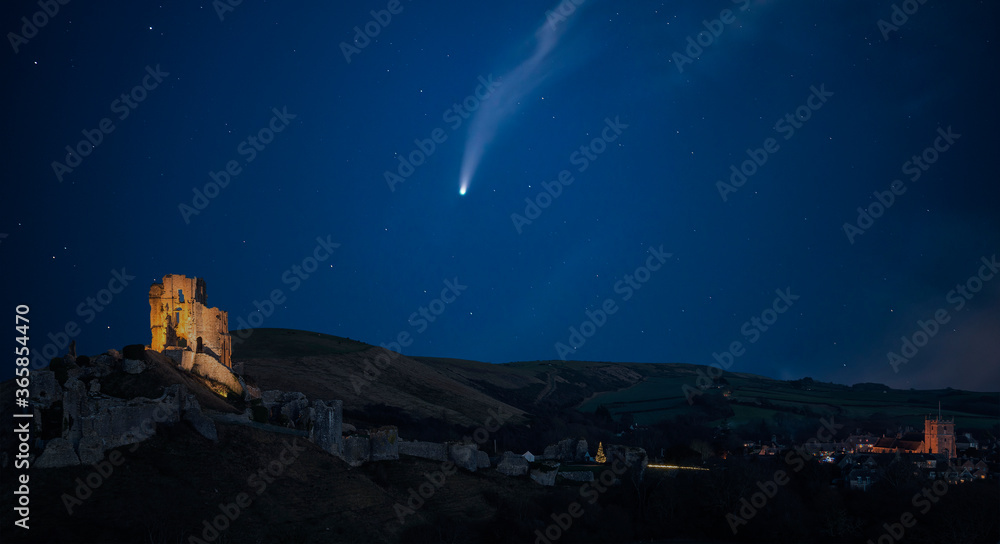Digital composite image of Neowise Comet over Lovely Medieval castle landscape during Autumn dusk light with moon