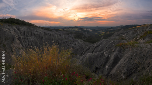 Badlands and rossena castle at sunset photo