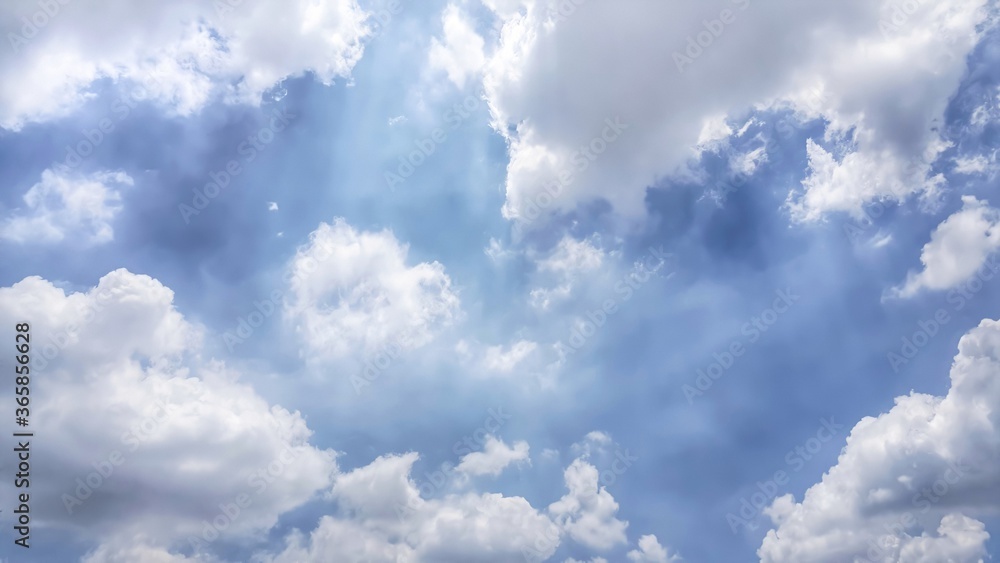 Fototapeta premium Many white cloud floating in blue sky with copy space.Water droplets and ice crystals gathered together into clumps. Floating in the azure atmosphere