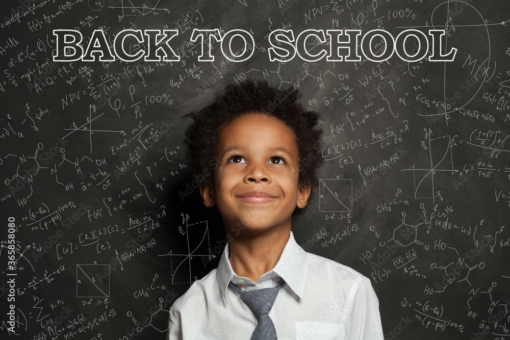 Smart African American child student boy smiling. Back to school concept Smart African American child student boy smiling. Back to school concept