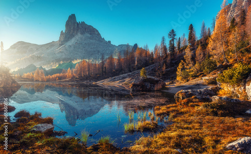 Scenic image of Fairy-tale Landscape, over the Federa lake, Dolomites Alps. Best Popular places for Photographers. Wonderful Autumn Scenery during Sunset. Travel recreational outdoor activity concept.