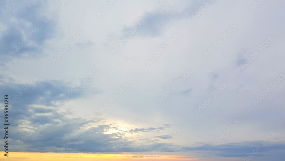 Sunset sky. Nightly sky with clouds and orange sunlight Sunset sky. Nightly sky with clouds and orange sunlight