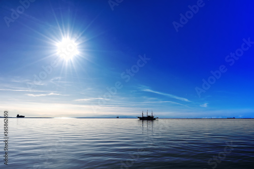 Blue sky and sea near Thessaloniki, Greece. Sailing boat