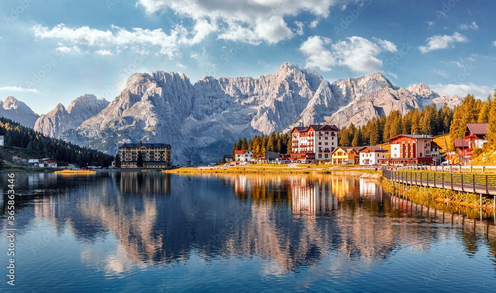Fototapeta premium Amazing tourquise Misurina lake with perfect sky reflection in calm water. Stunning view on the majestic Dolomites Alp Mountains, Italy, National Park Tre Cime di Lavaredo, Dolomiti Alps, Tyrol
