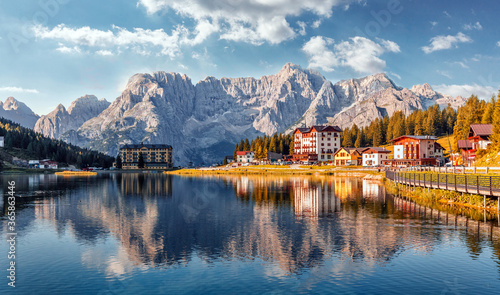 Amazing tourquise Misurina lake with perfect sky reflection in calm water. Stunning view on the majestic Dolomites Alp Mountains, Italy, National Park Tre Cime di Lavaredo, Dolomiti Alps, Tyrol