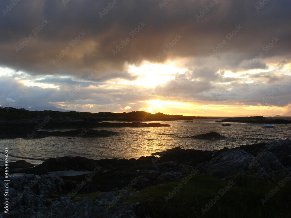Sunset over the sea off the North West coast of Scotland near Arisaig. Sunset over the sea off the North West coast of Scotland near Arisaig.