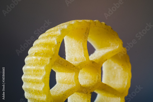 Macro photography of a wheel-shaped pasta