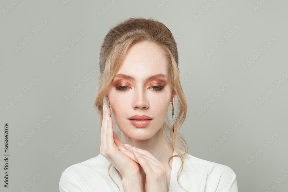 Attractive model woman face with clear healthy skin, makeup and manicured nails on hands close up portrait Attractive model woman face with clear healthy skin, makeup and manicured nails on hands close up portrait