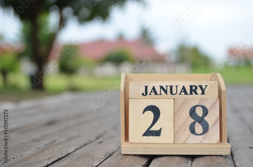 January 28, Number cube with a natural background. 