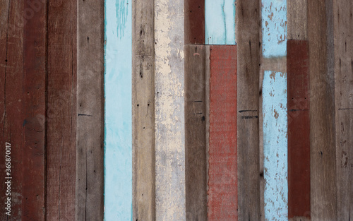 Old colourful wooden wall material background for vintage wallpaper.